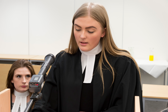 Female law student in Moot Court