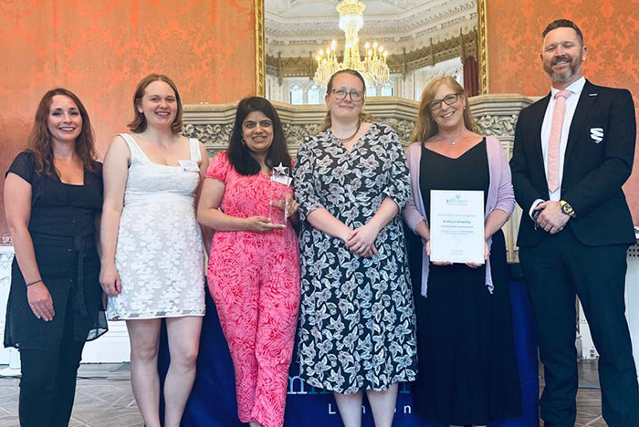 group photo of widening participation team in waldegrave drawing room