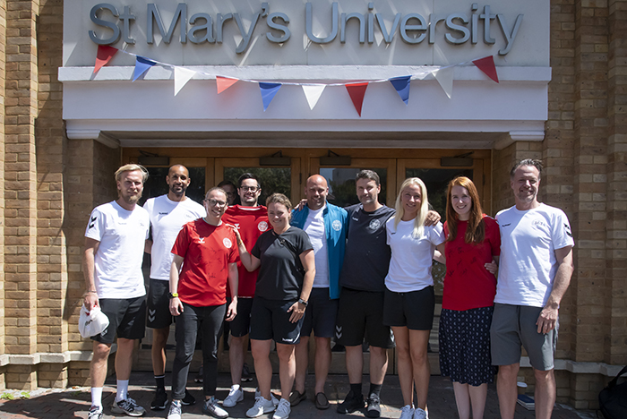 group photo of Danish FA representatives and St Mary's staff