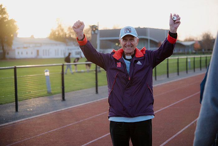 Father Vlad celebrating completing his challenge