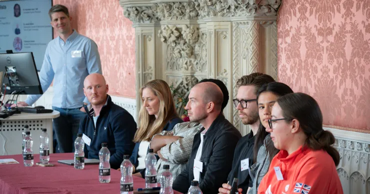 A panel of people at a research event in the Waldegrave Drawing Room.