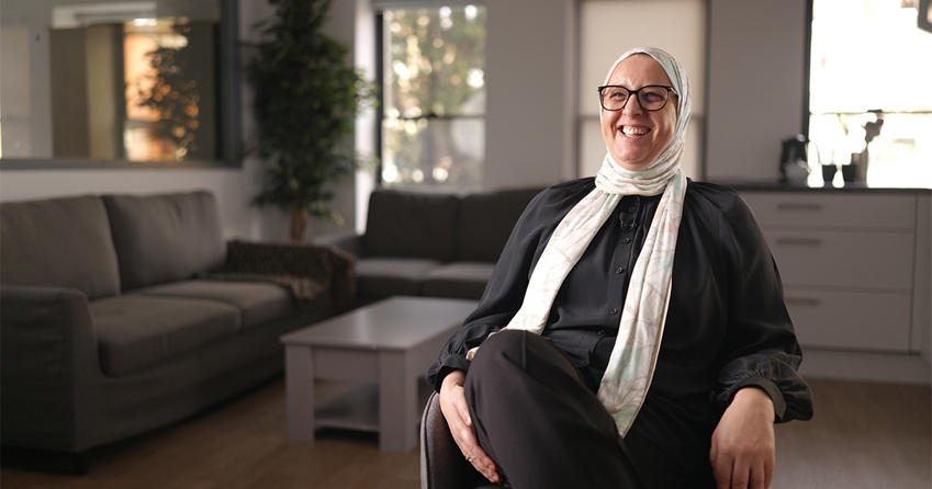 Prof Samira Ben Omar sat in a lounge environment 