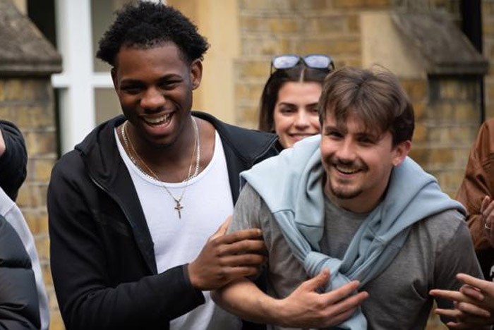 Two students laughing