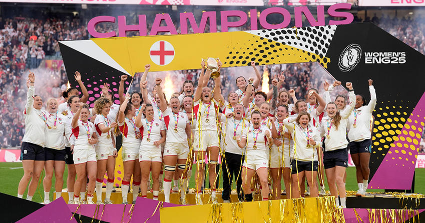 England women's rugby team lifting world cup trophy in twickenham stadium