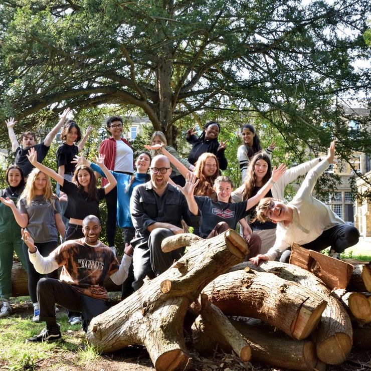 Young students pose excitedly for the camera within the grounds of St Mary's University.
