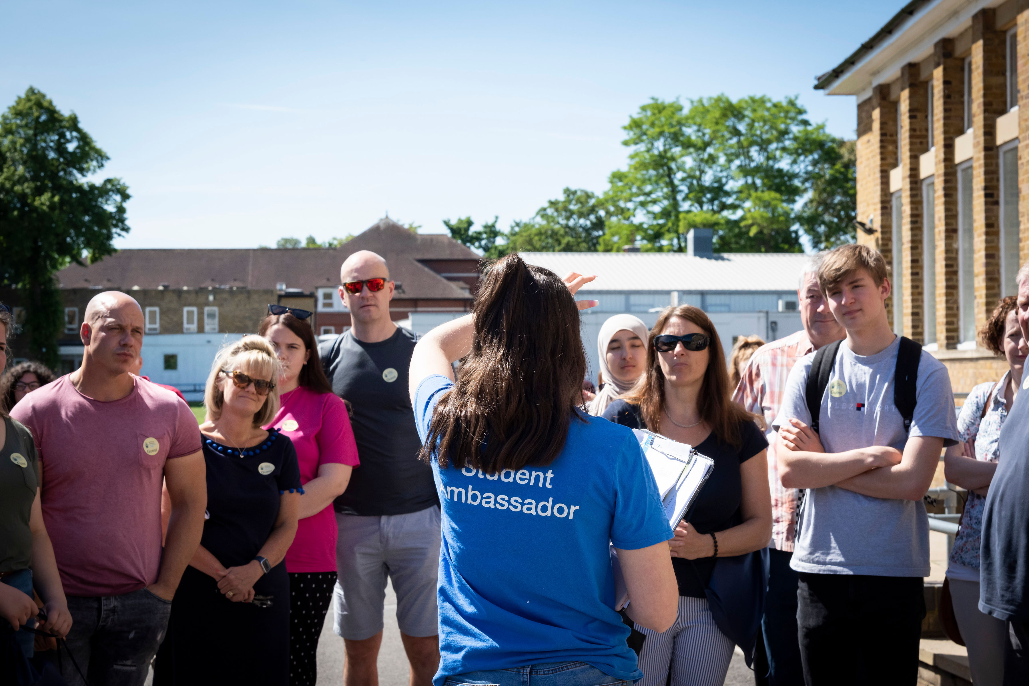 A student ambassador introducing themselves before a campus tour at the St Mary's University Open Day
