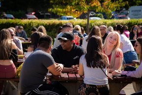 Students sat around bench during an event