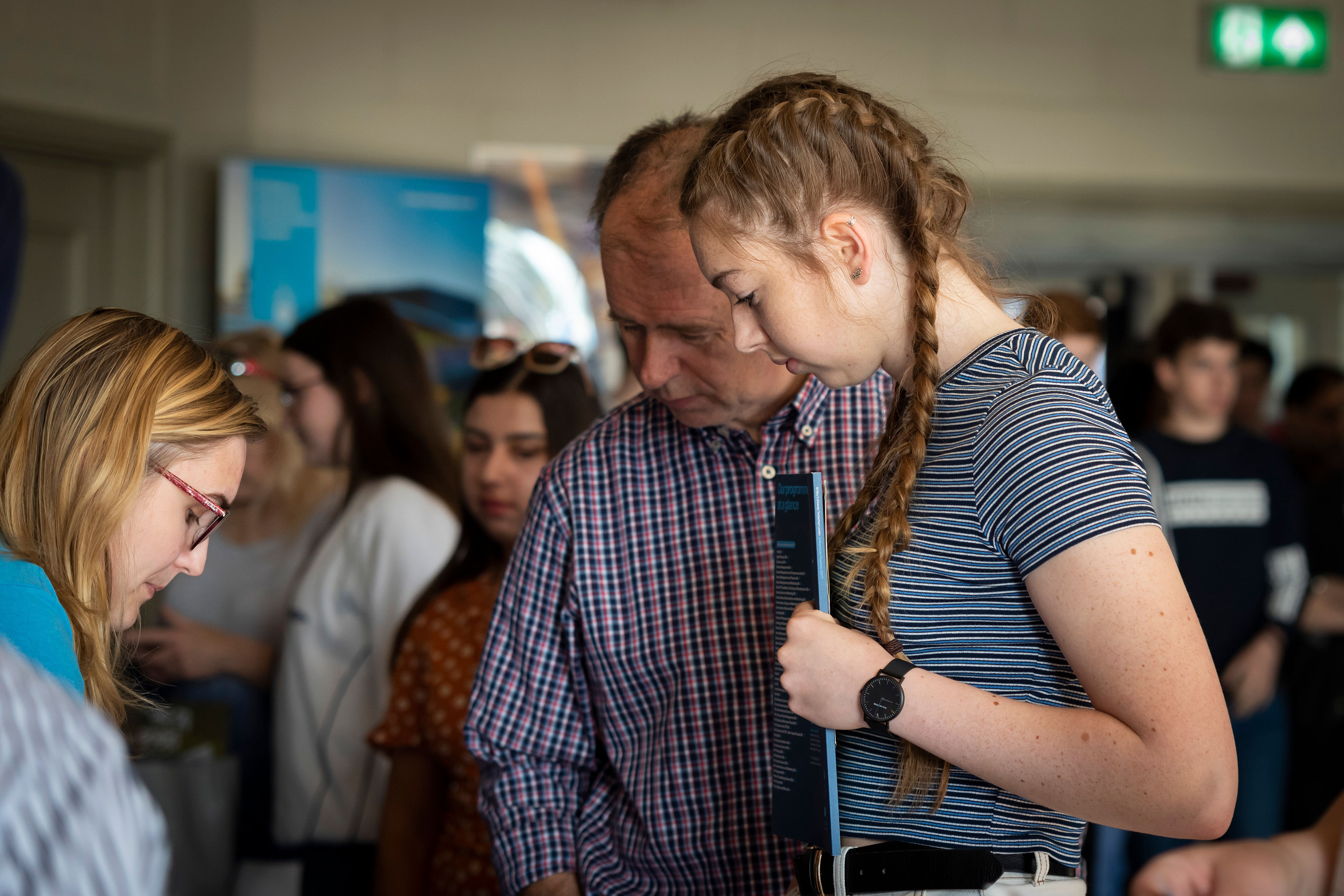 Open Day visitors talking to a St Mary's University staff member
