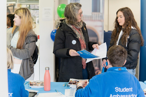 Parents speaking with a student ambassador