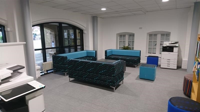 View of the Student Hub phase 1 showing sofas and copiers/printers