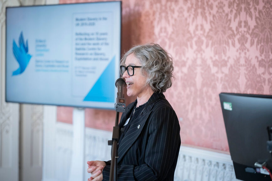 Carole Murphy speaking at an event.