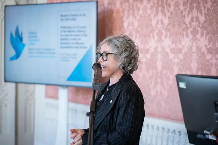 Carole Murphy speaking at an event.