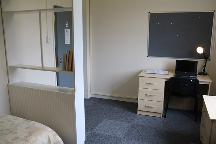 Shelves, desk and pin board in Graham bedroom