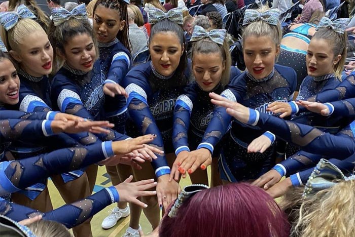 Cheerleading team in a group huddle