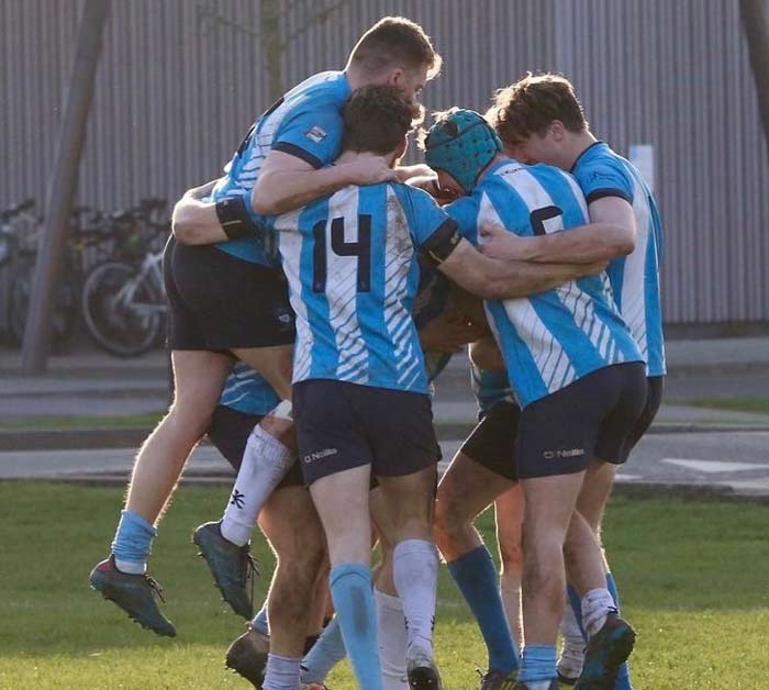 A group of the Men's Rugby Union team celebrating a try