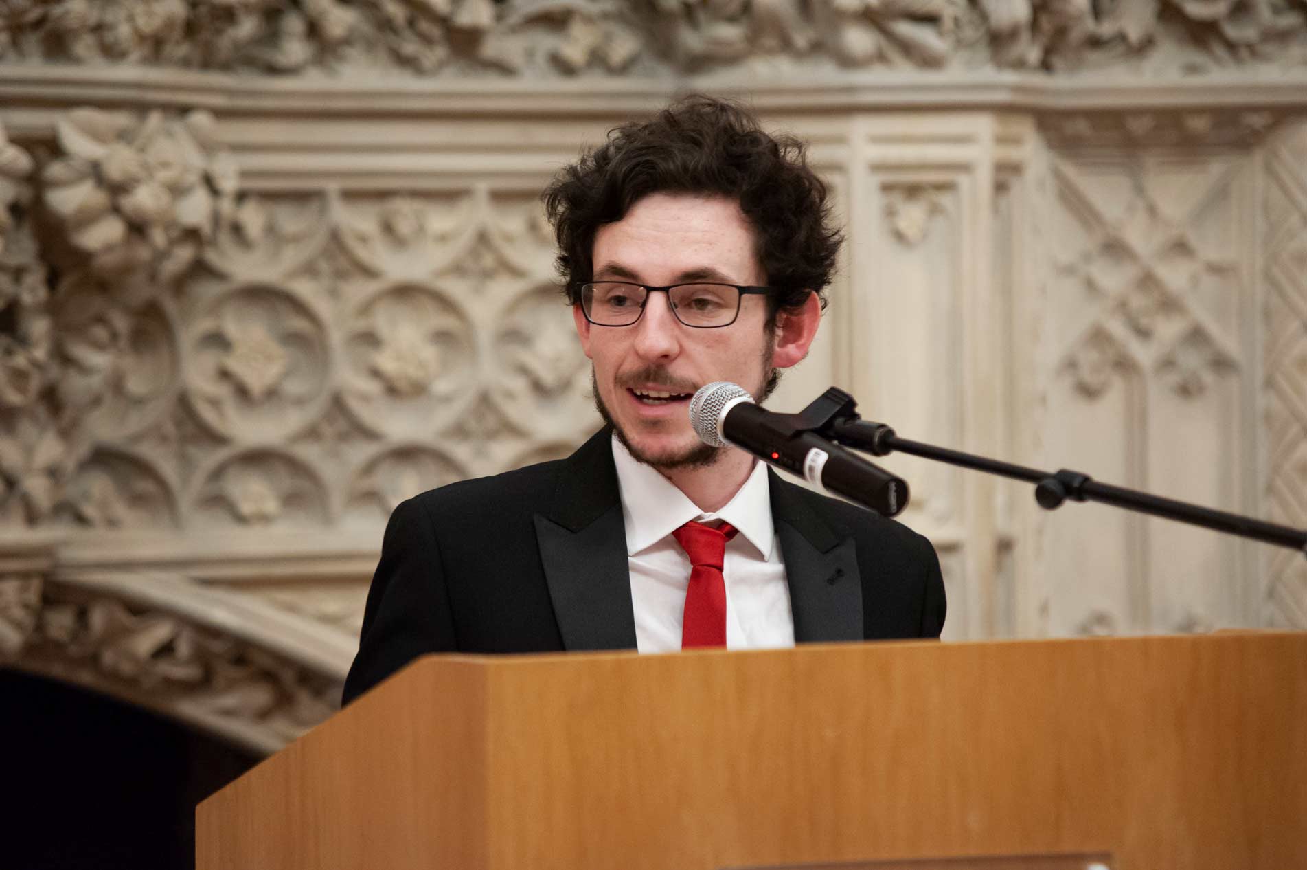 Conal Baxter speaking at an event.