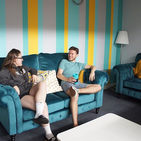 Students sitting on the sofa in the commuter lounge