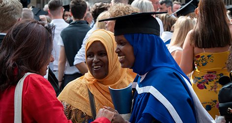 Family celebrating with graduate at their graduation